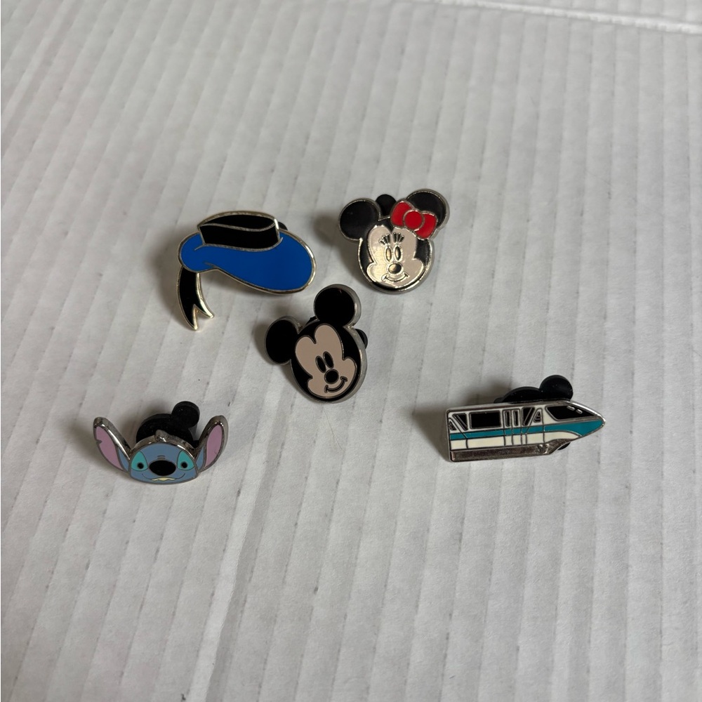 Disneyland pins Disney Micke Minnie Stitch Donald hat and monorail.